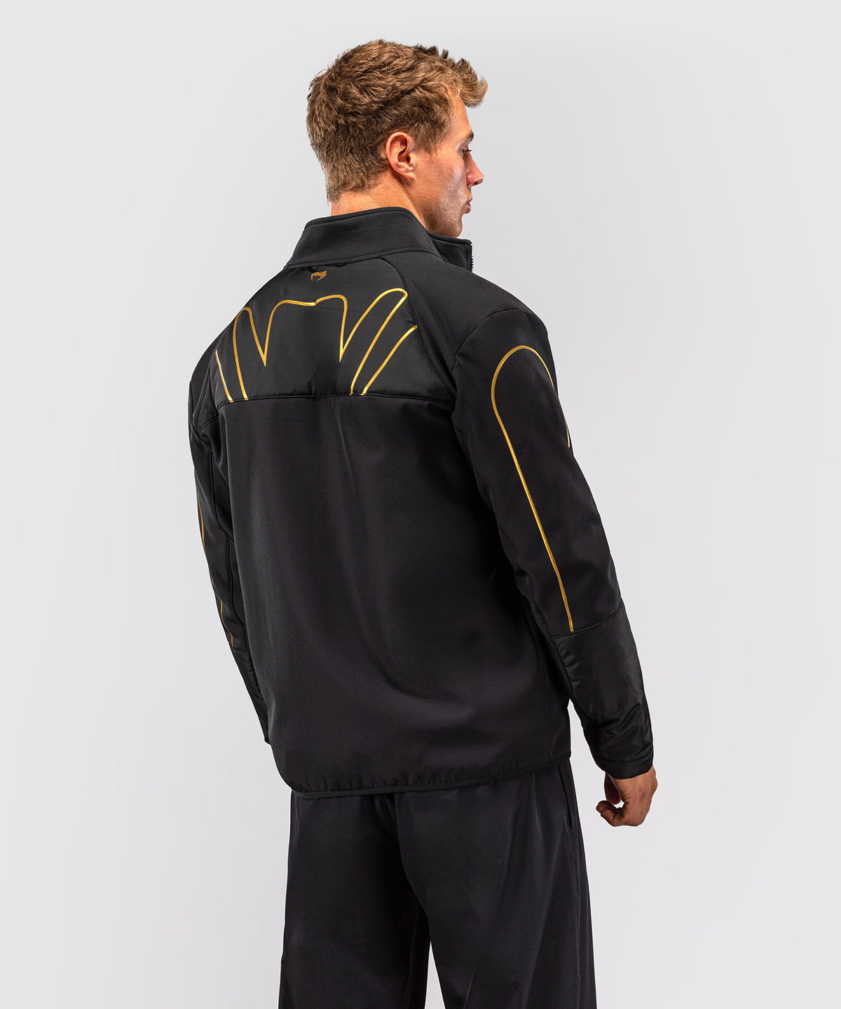 Venum Paddock Chaqueta softshell - Negro/Dorado