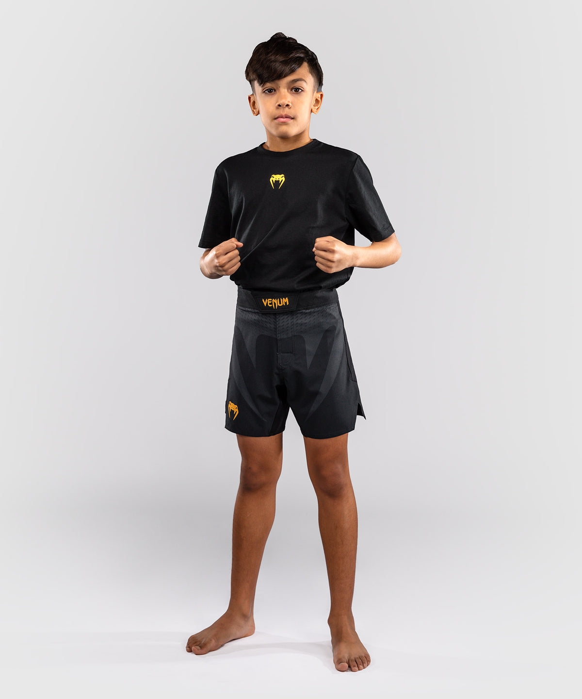 Venum Attack Fightshorts para niños - Negro/Dorado