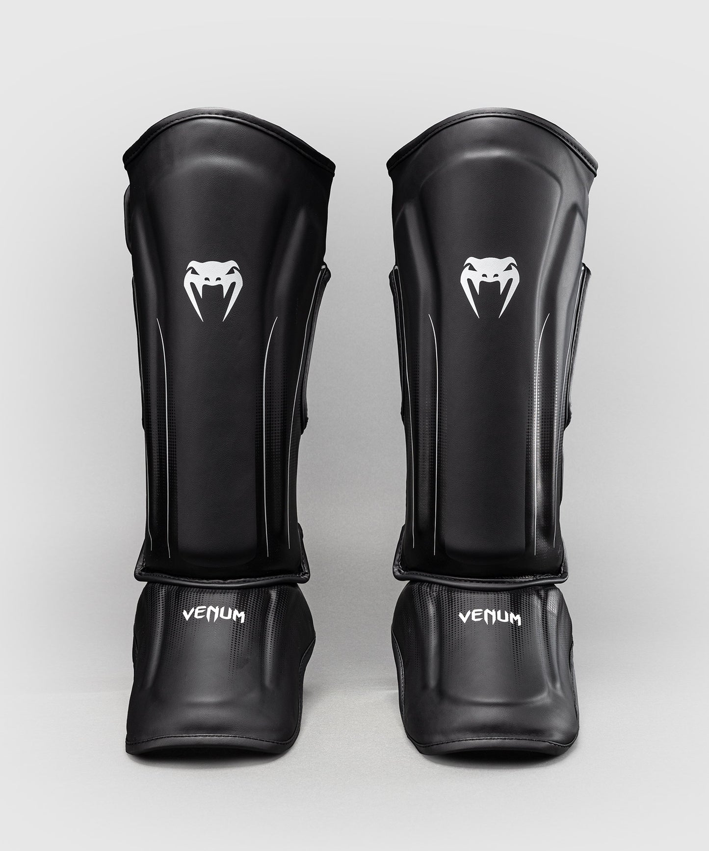 Venum Stealth Espinilleras – Negro/Blanco