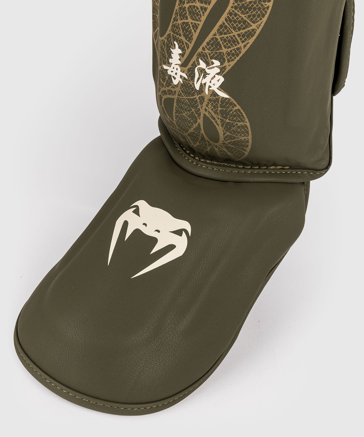 Venum Serpenti Espinilleras – Caqui/Bronce/Marfil