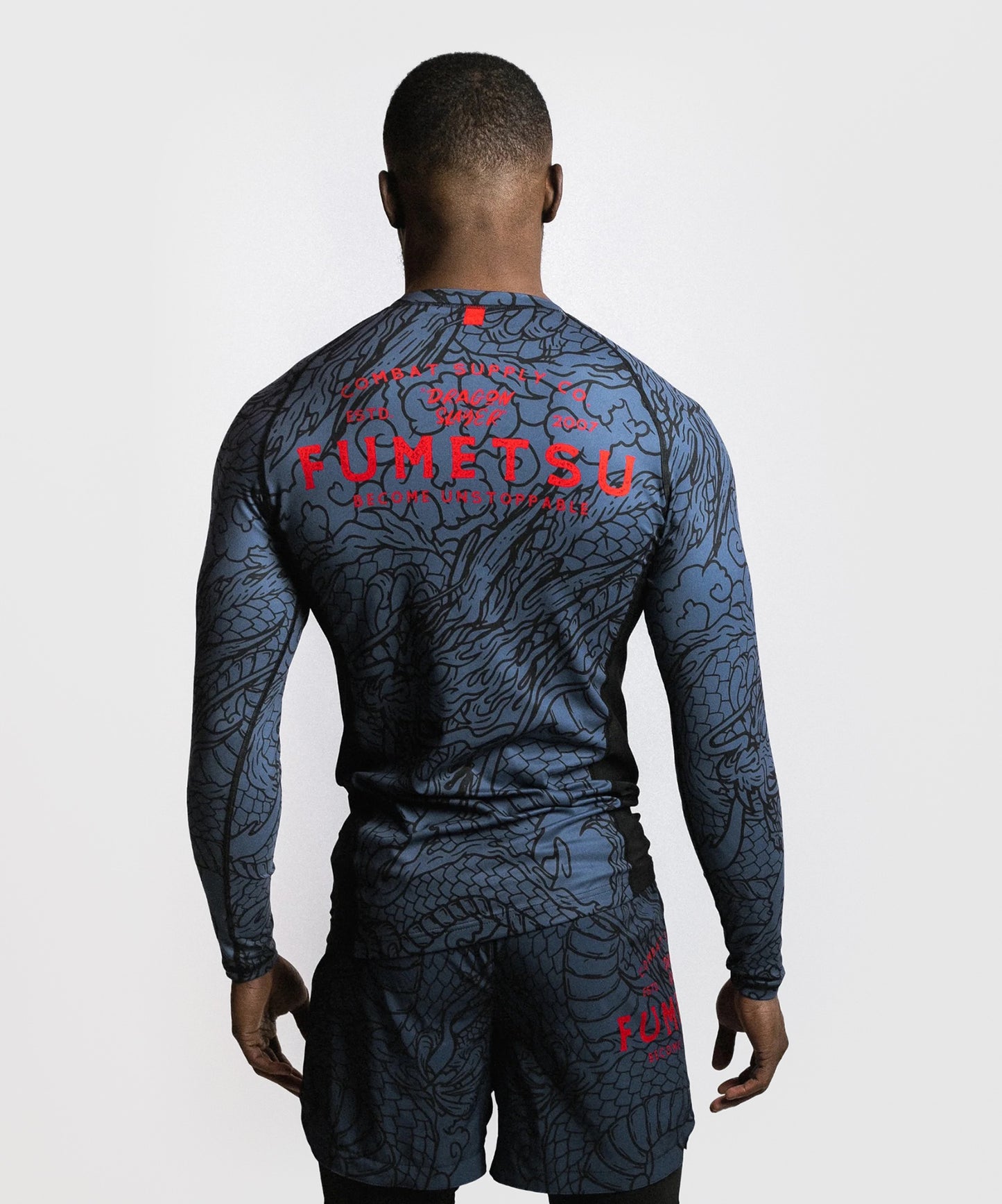 Fumetsu Dragon Slayer Rashguard de Manga Larga - Azul/Rojo