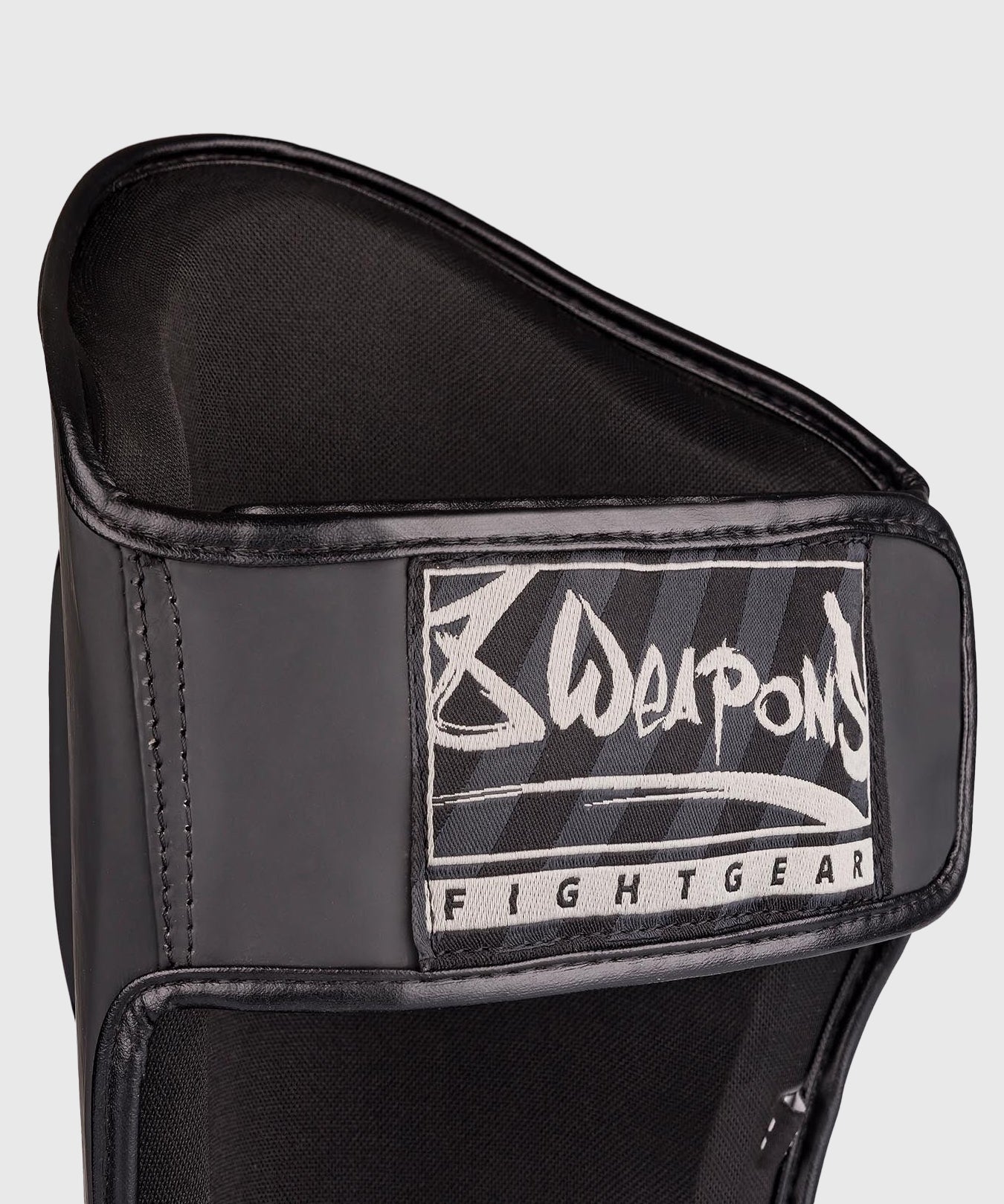 8 Weapons Unlimited 2.0 Espinilleras - Negro/Negro