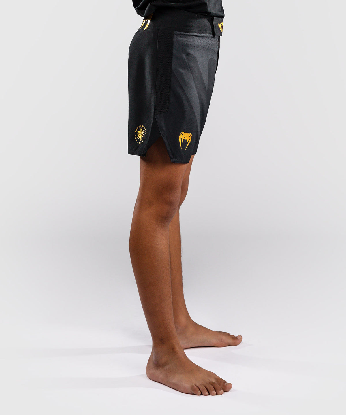 Venum Attack Fightshorts para niños - Negro/Dorado