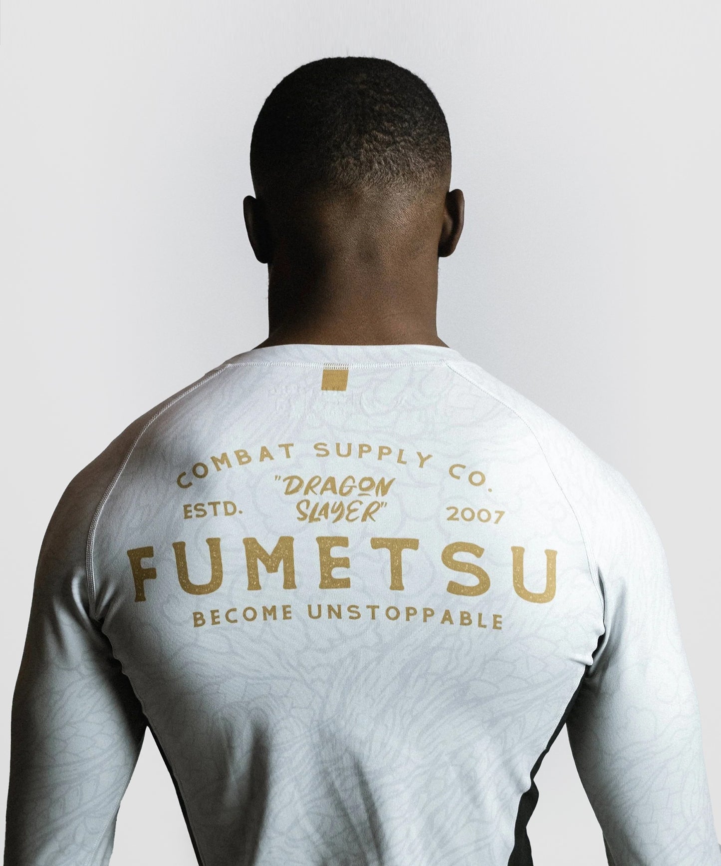 Fumetsu Dragon Slayer Long Sleeve Rashguard - White/Gold