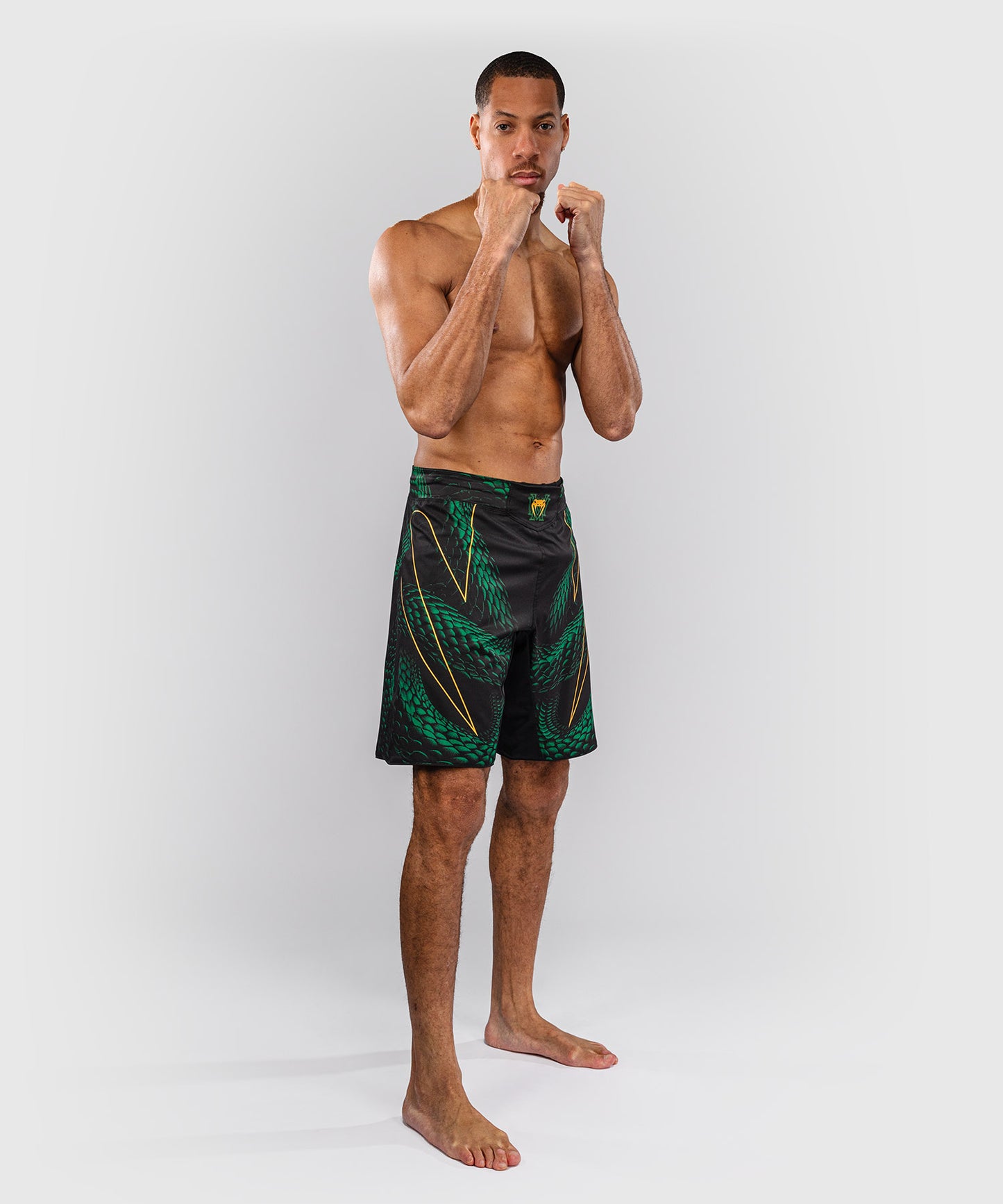 Venum Matupa Short de Combate - Negro/Verde/Oro
