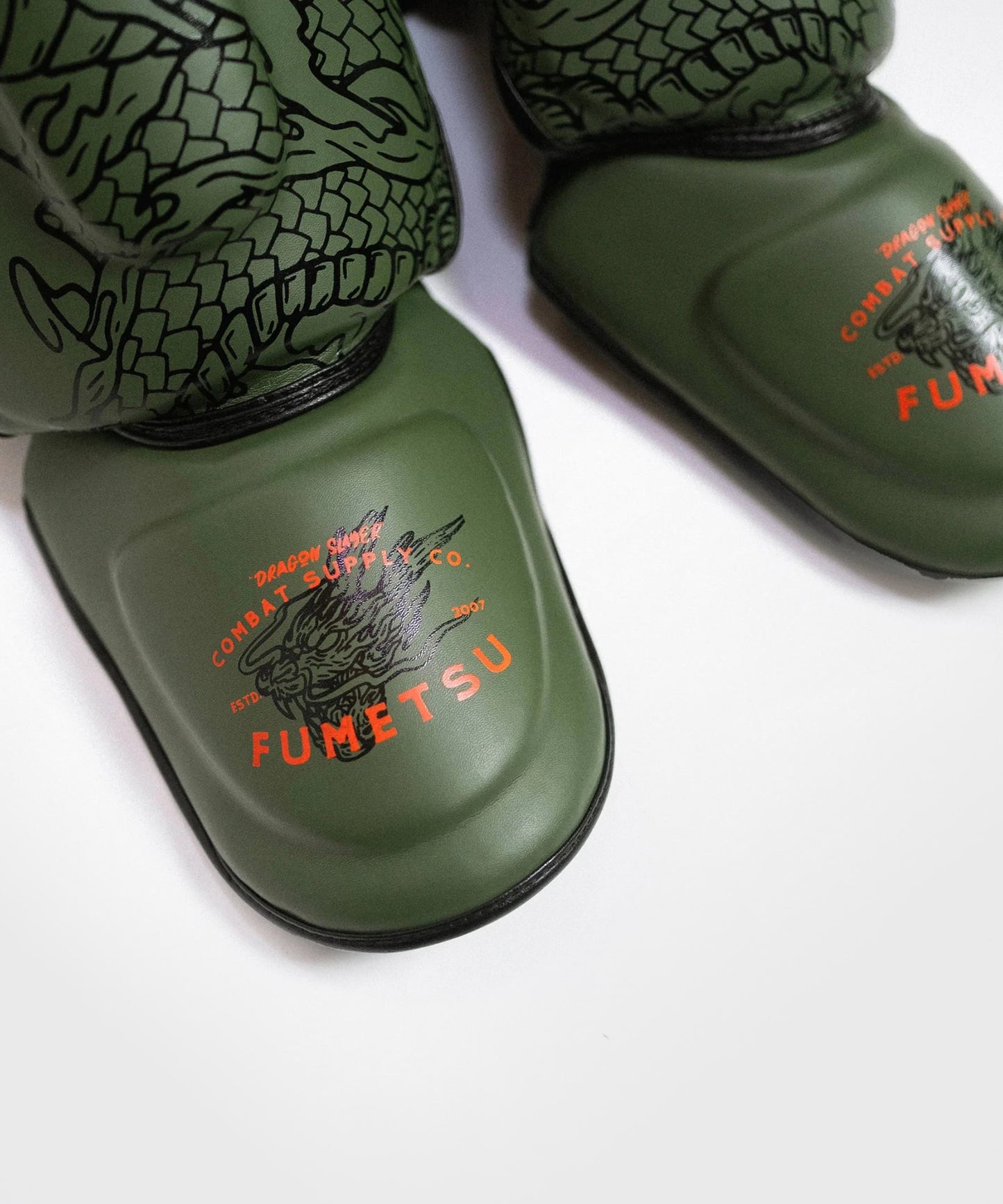 Fumetsu Dragon Slayer shin guards - Khaki/Orange