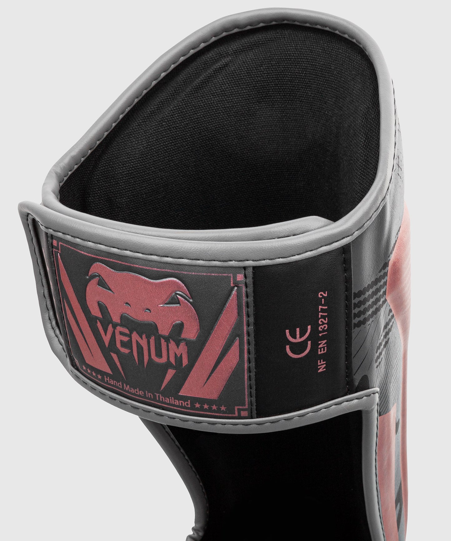 Protège-tibias Venum Elite – Noir/Rose/Or